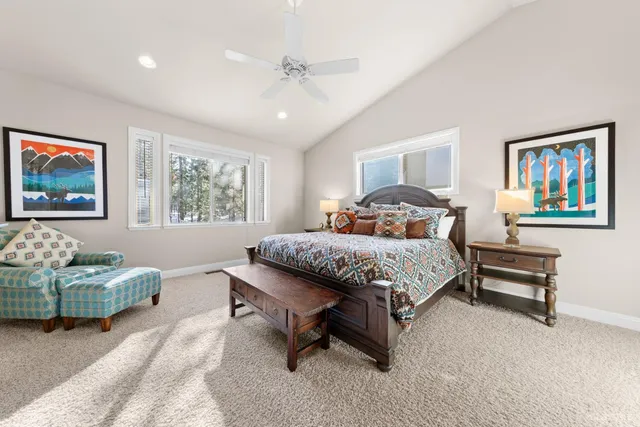 a bedroom with a bed window and wall painting