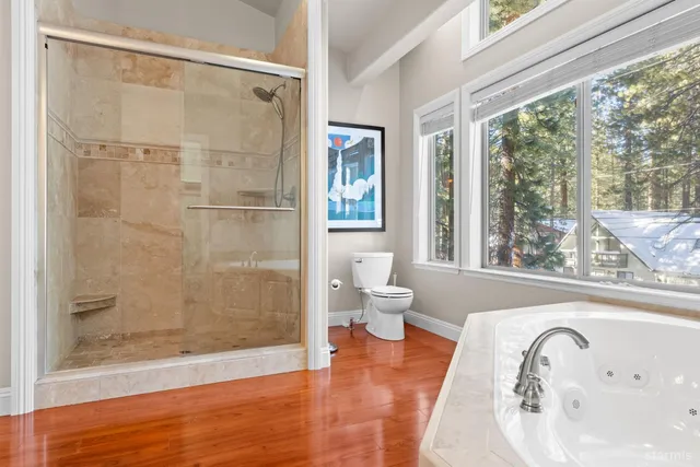 a bathroom with a bathtub and a shower
