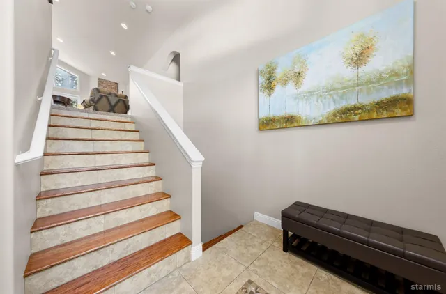 a view of entryway with stairs and wooden floor