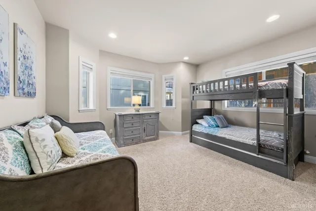 a bedroom with furniture and a fireplace