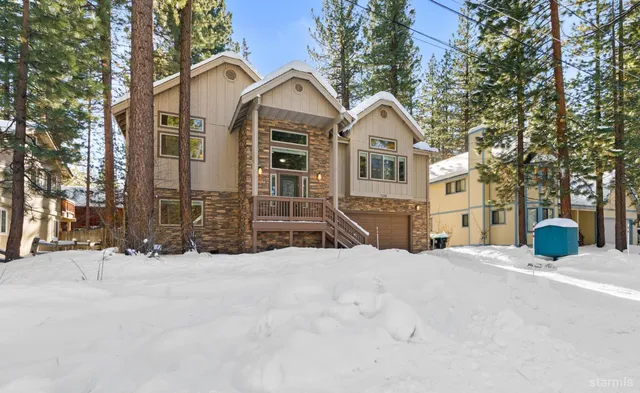 a view of a house with snow on the background