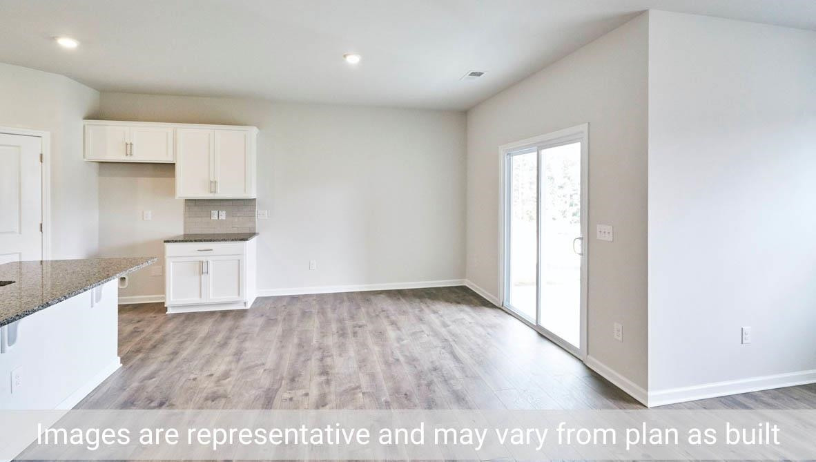 7663 Sand Pit Road Stantonsburg, NC 27883 - Photo 13 of 22 an empty room with wooden floor