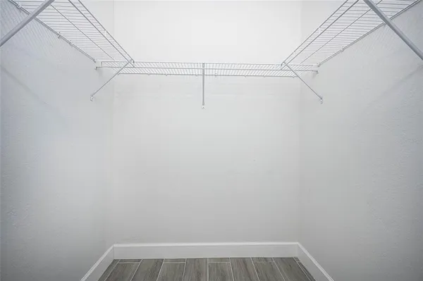a bathroom with a double vanity sink mirror and shower