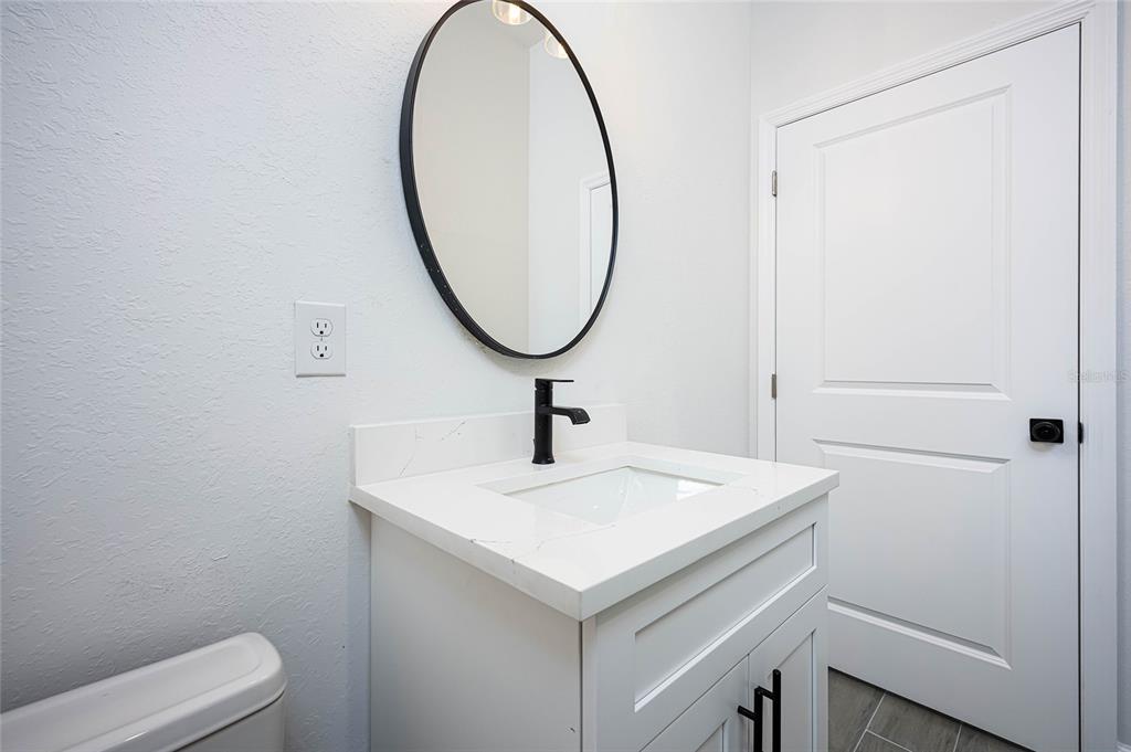 185 Sesame Road East Rotonda West, FL 33947 - Photo 30 of 60 a bathroom with a sink and a vanity