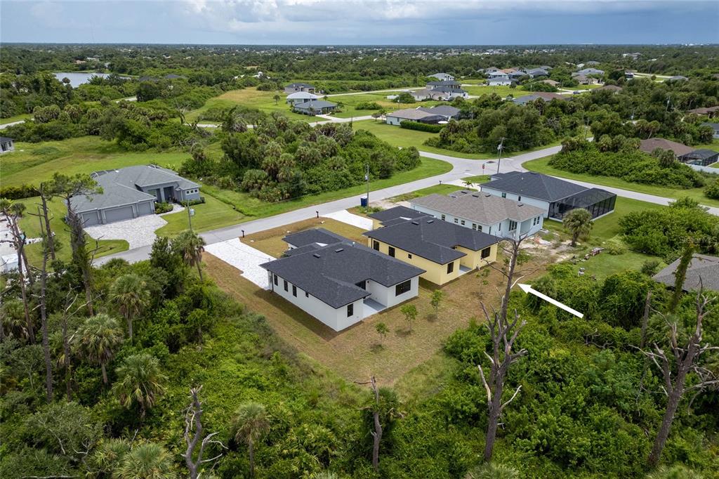 185 Sesame Road East Rotonda West, FL 33947 - Photo 43 of 60 an aerial view of a house with a yard