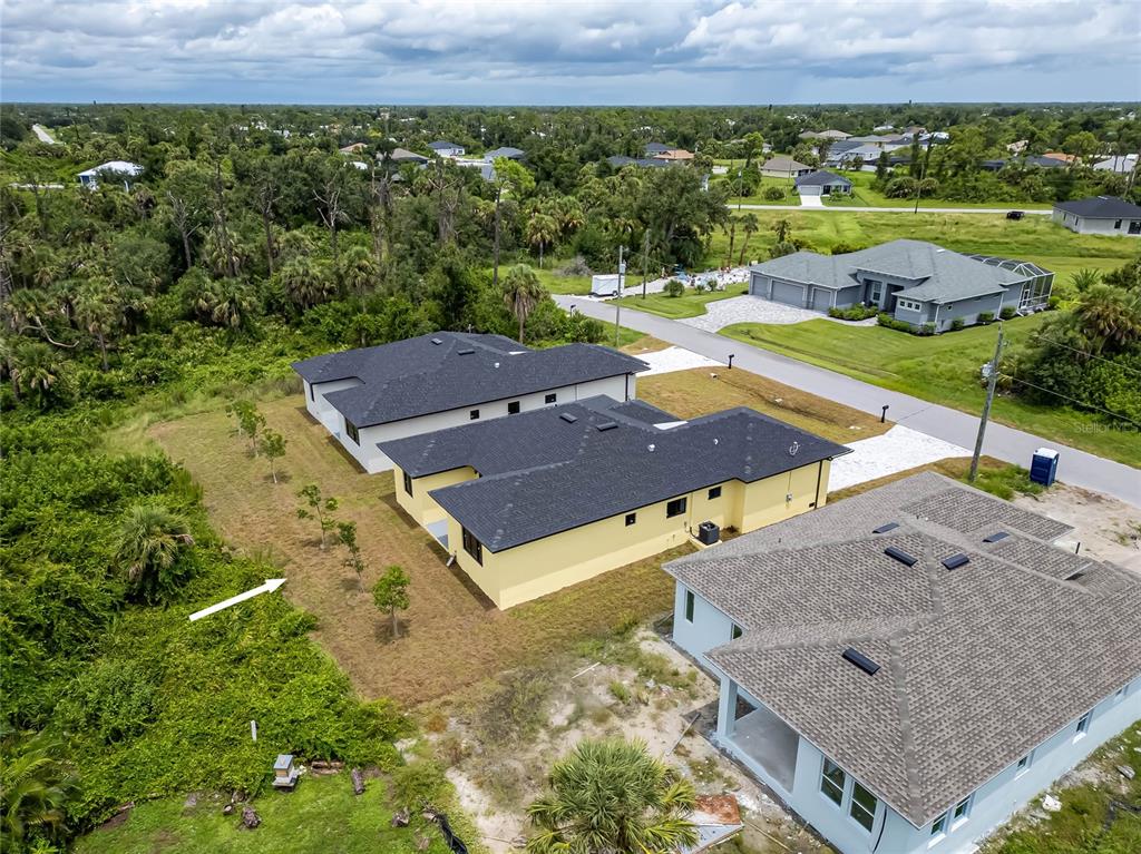 185 Sesame Road East Rotonda West, FL 33947 - Photo 46 of 60 an aerial view of a house with a yard