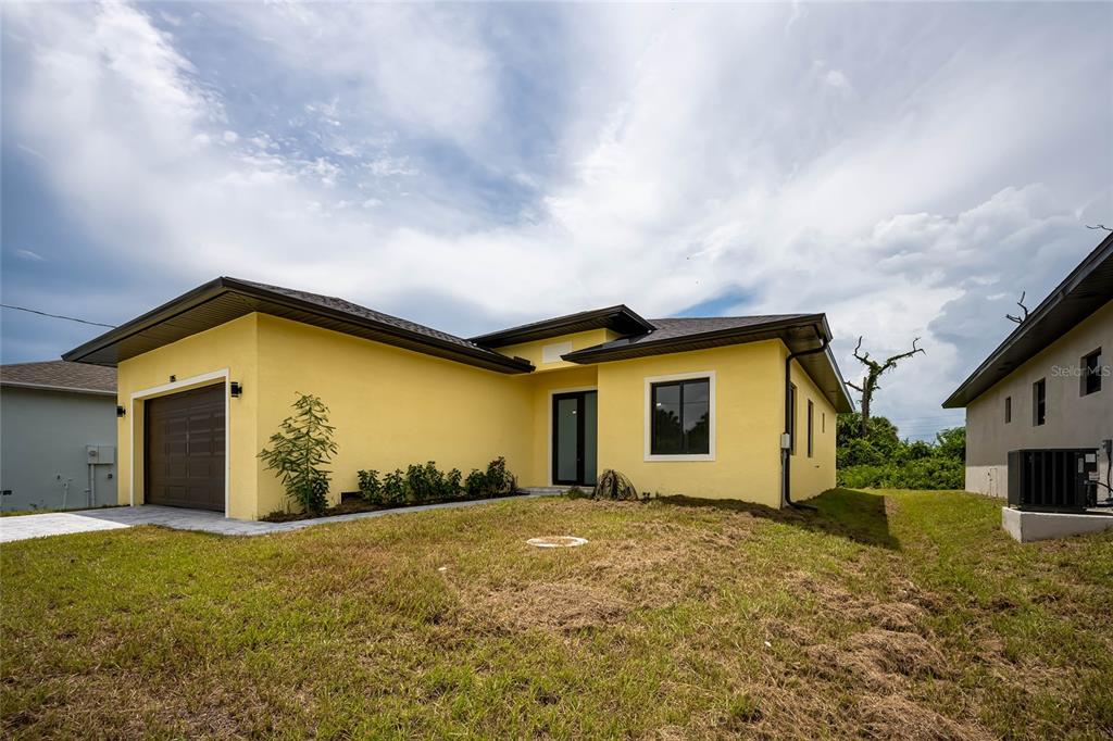 185 Sesame Road East Rotonda West, FL 33947 - Photo 56 of 60 a view of a house with a backyard