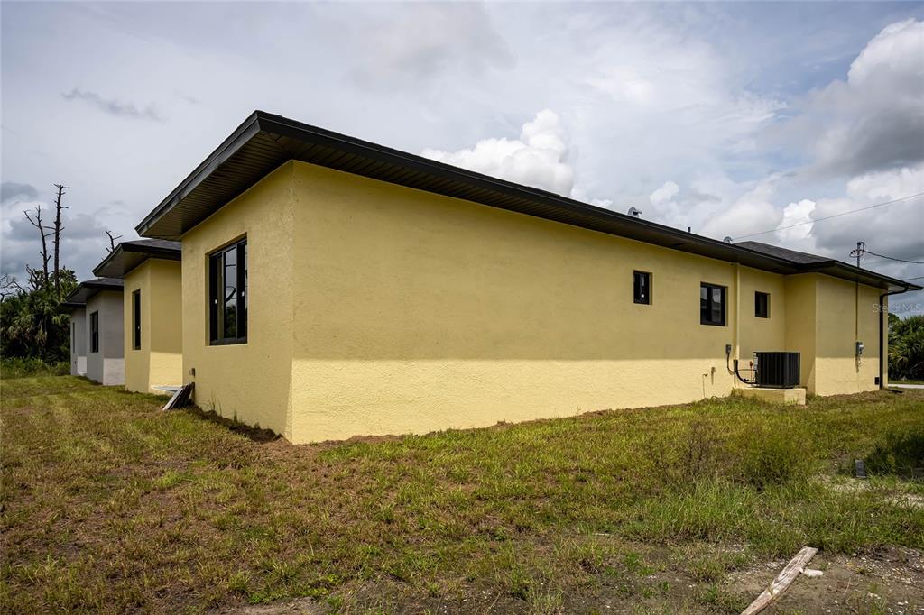 185 Sesame Road East Rotonda West, FL 33947 - Photo 59 of 60 a house view with a outdoor space