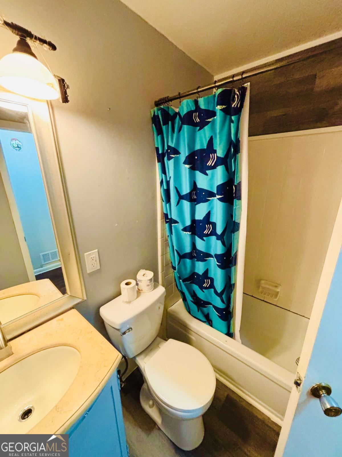445 Vincent Drive Athens, GA 30607 - Photo 12 of 21 a bathroom with a sink toilet and shower
