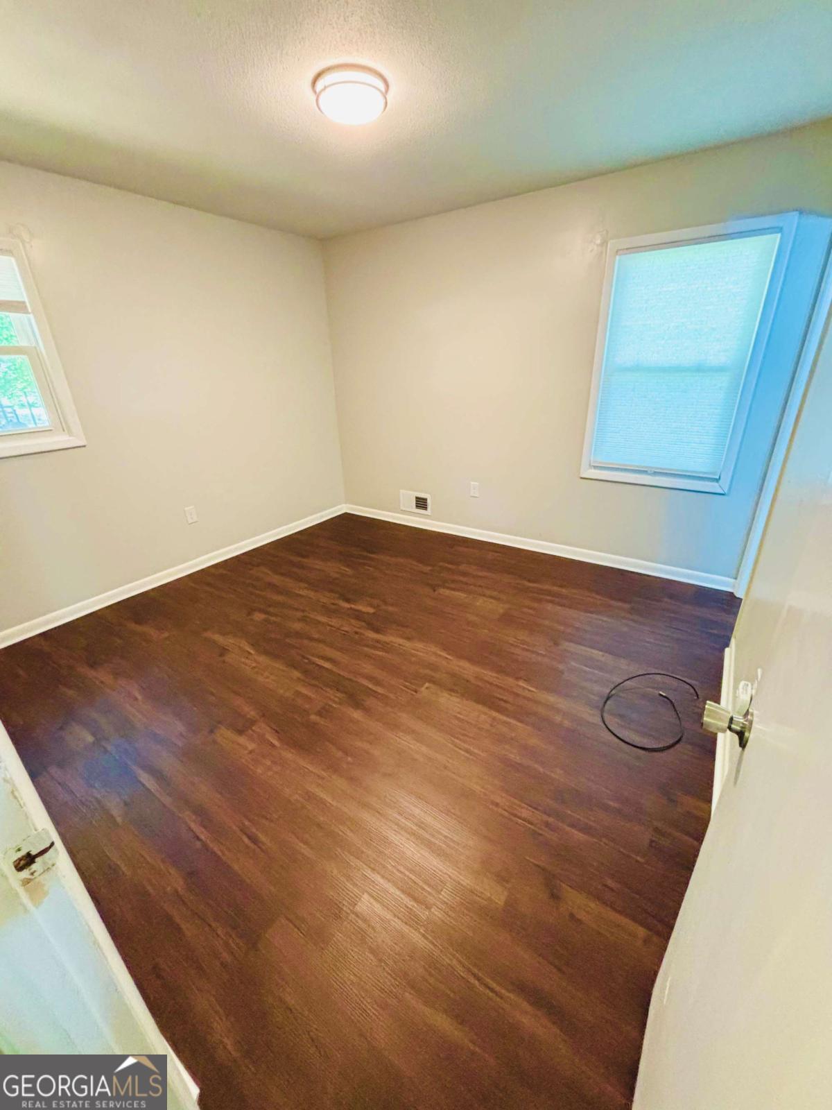 445 Vincent Drive Athens, GA 30607 - Photo 14 of 21 a view of empty room with wooden floor