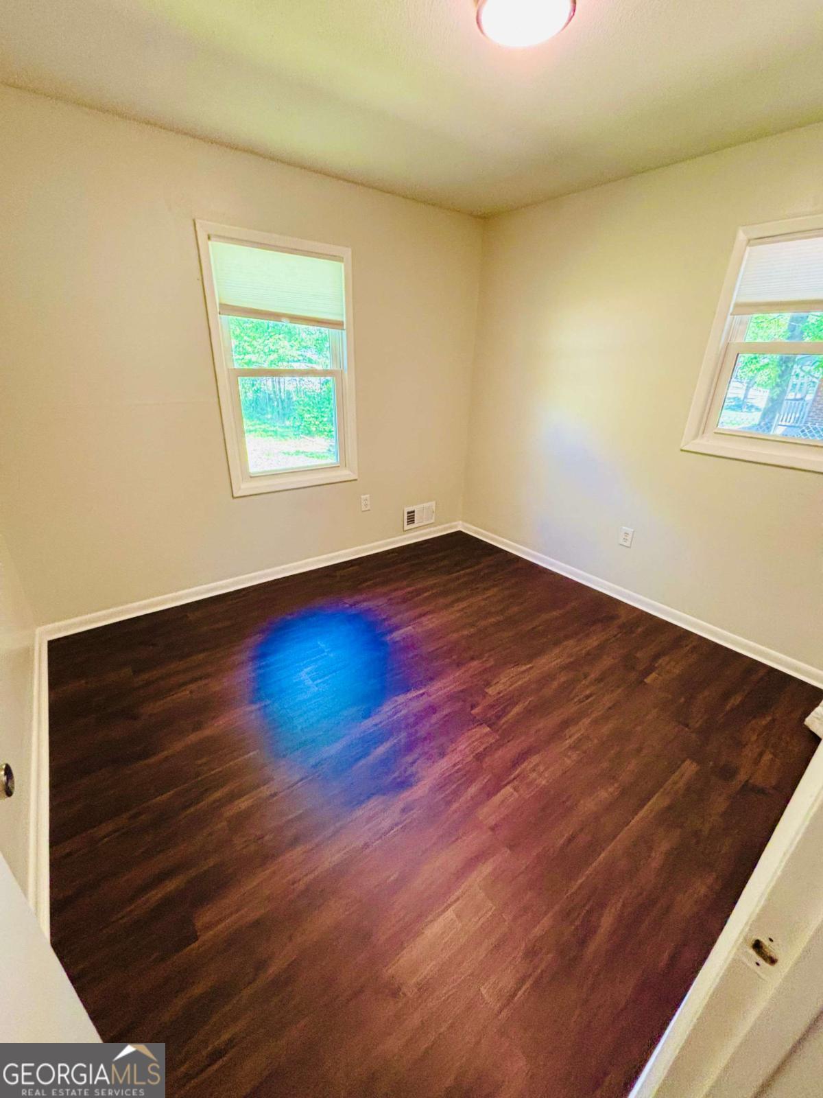 445 Vincent Drive Athens, GA 30607 - Photo 15 of 21 an empty room with wooden floor and windows