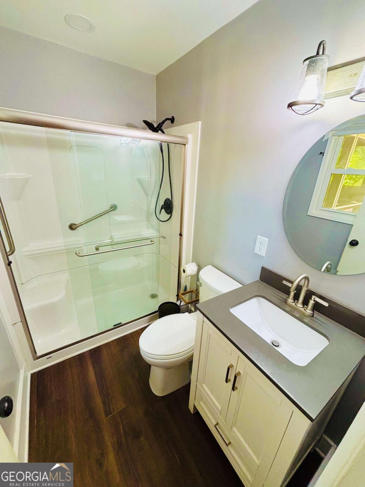 445 Vincent Drive Athens, GA 30607 - Photo 17 of 21 a bathroom with a granite countertop sink toilet and a mirror