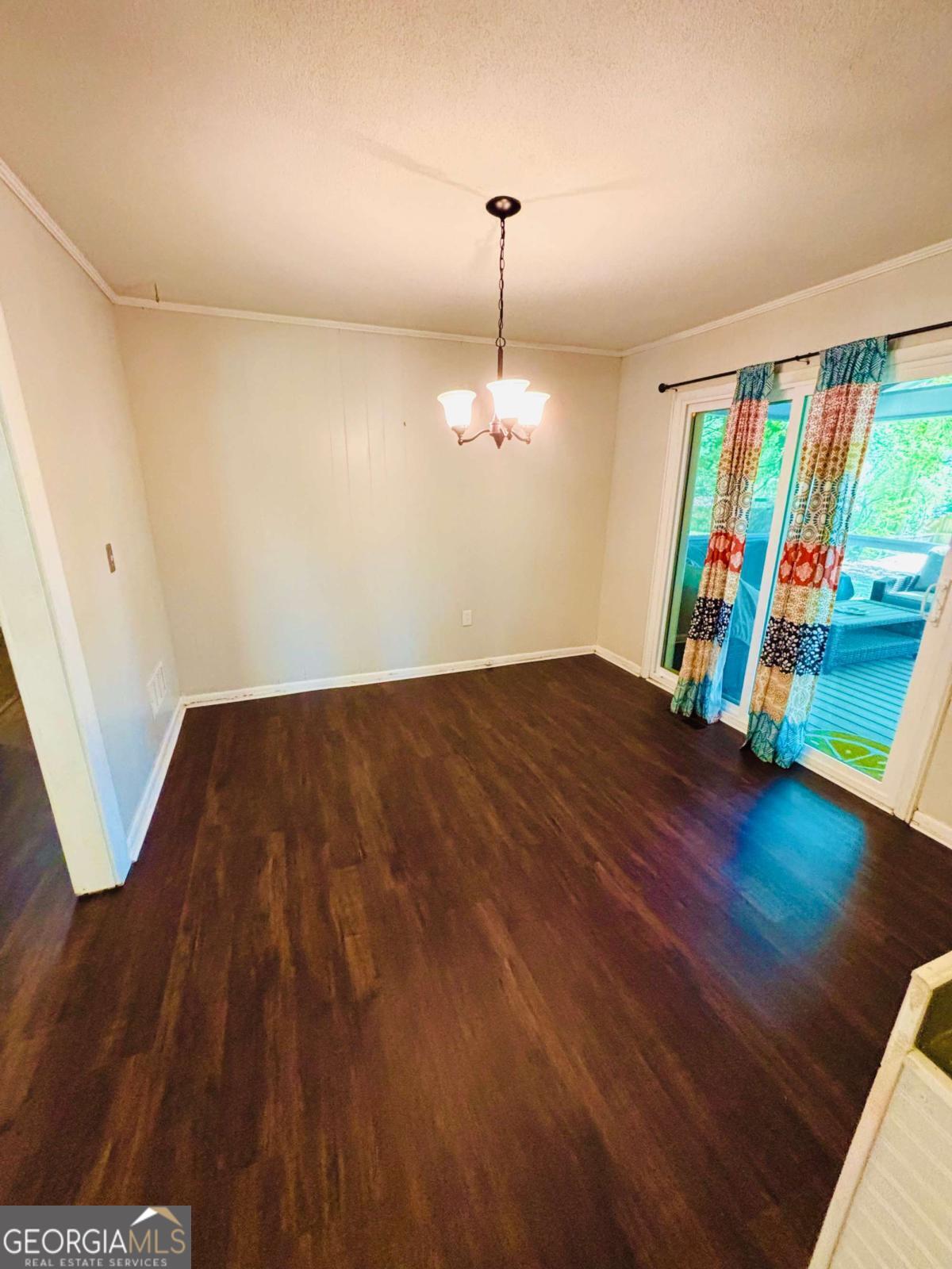 445 Vincent Drive Athens, GA 30607 - Photo 8 of 21 a view of an empty room with wooden floor