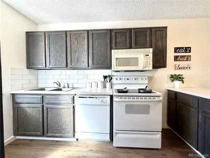 a kitchen with a stove and a sink