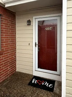 a view of a door and a window