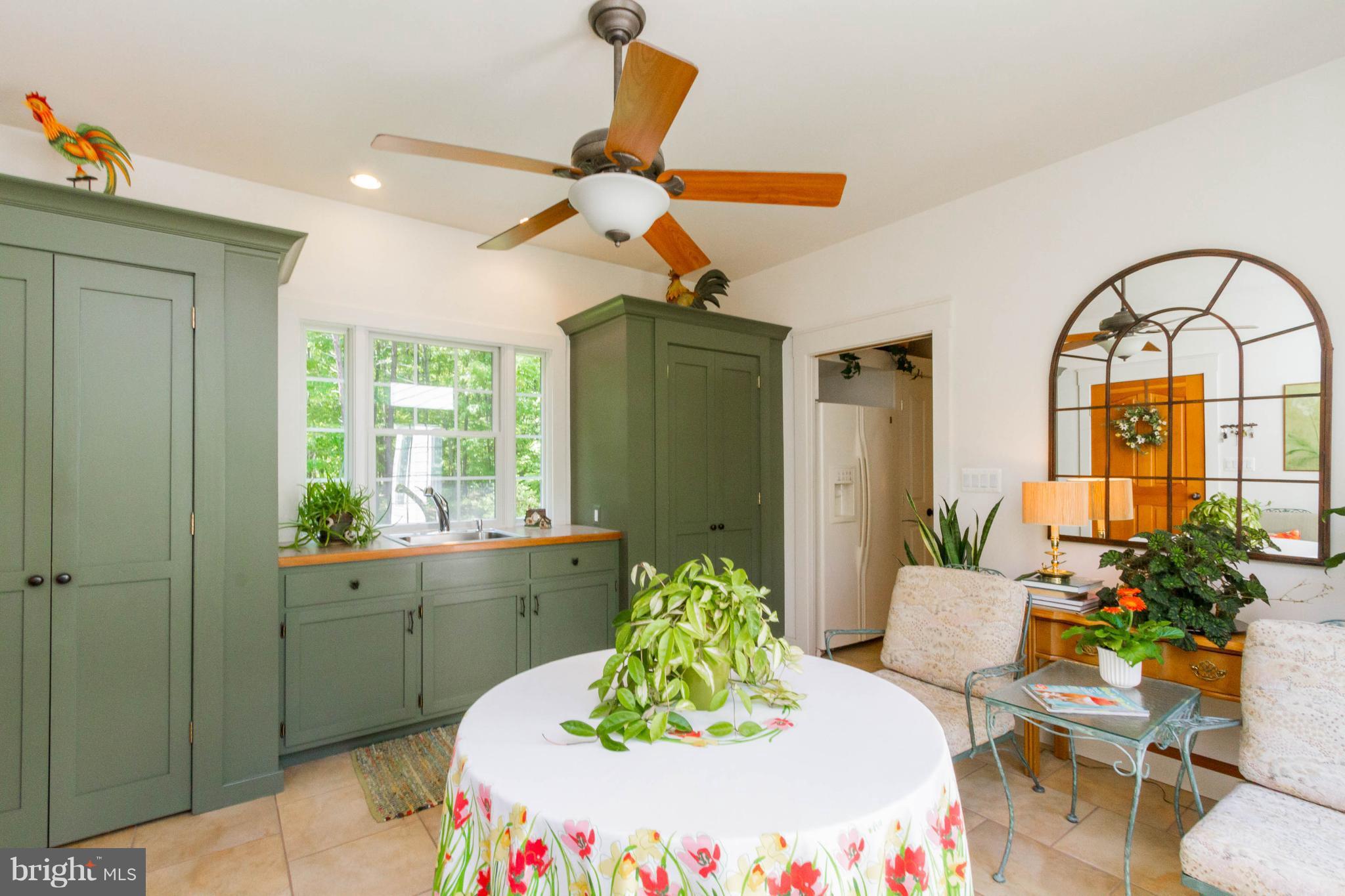 4109 Goldmine Road Goldvein, VA 22720 - Photo 11 of 30 Sunroom with pocket doors to kitchen