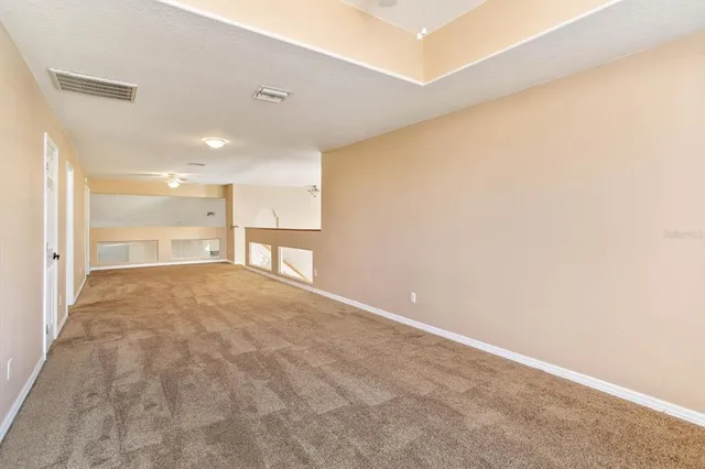 a bathroom with a granite countertop sink toilet a mirror and shower