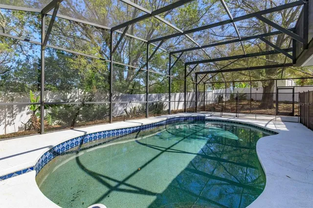 a view of a swimming pool with a yard
