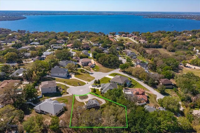 an aerial view of a house with a ocean view