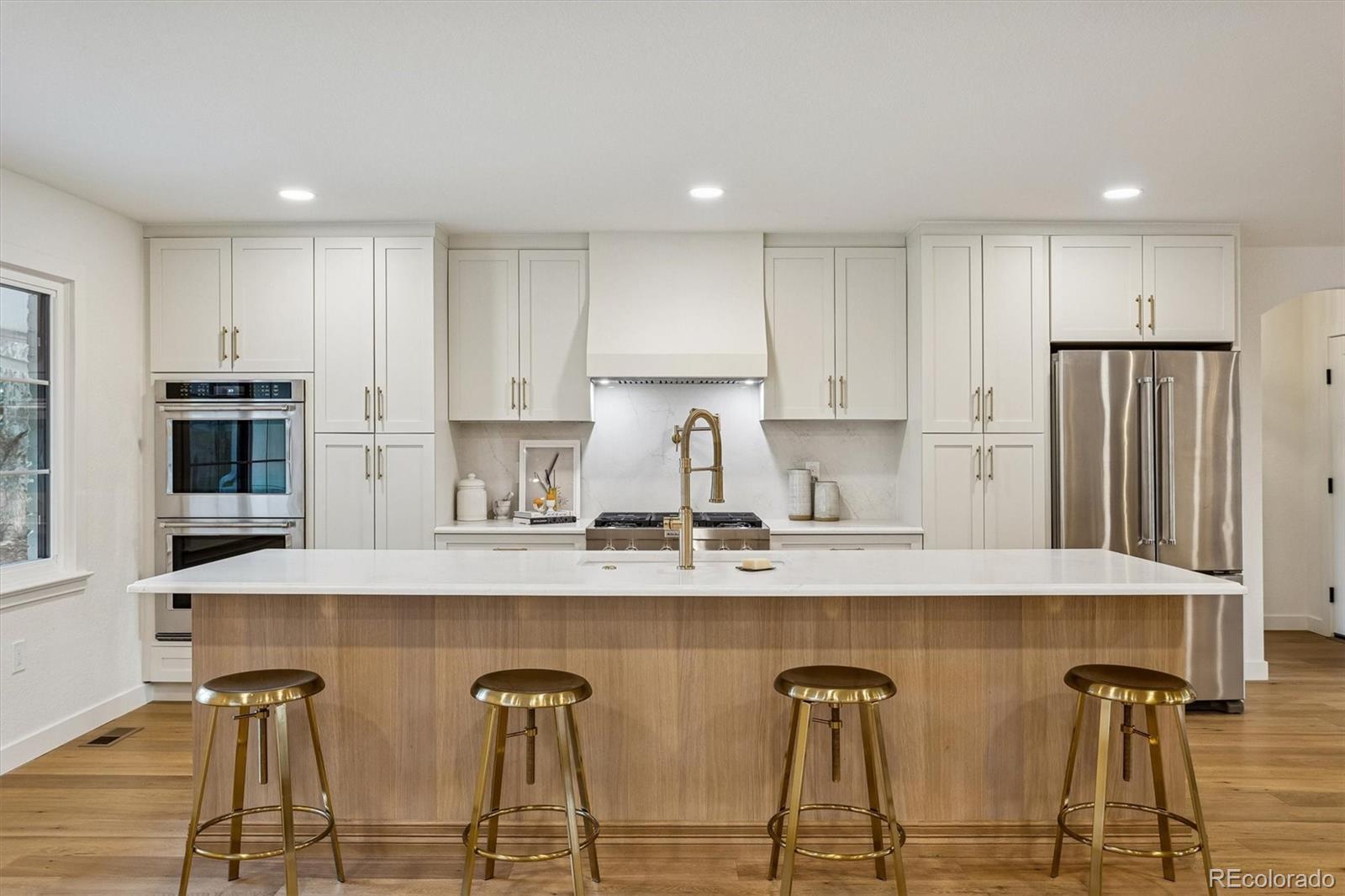 4872 Country Club Way Boulder, CO 80301 - Photo 12 of 48 a kitchen with stainless steel appliances granite countertop a kitchen island a stove a cabinets a sink and a refrigerator