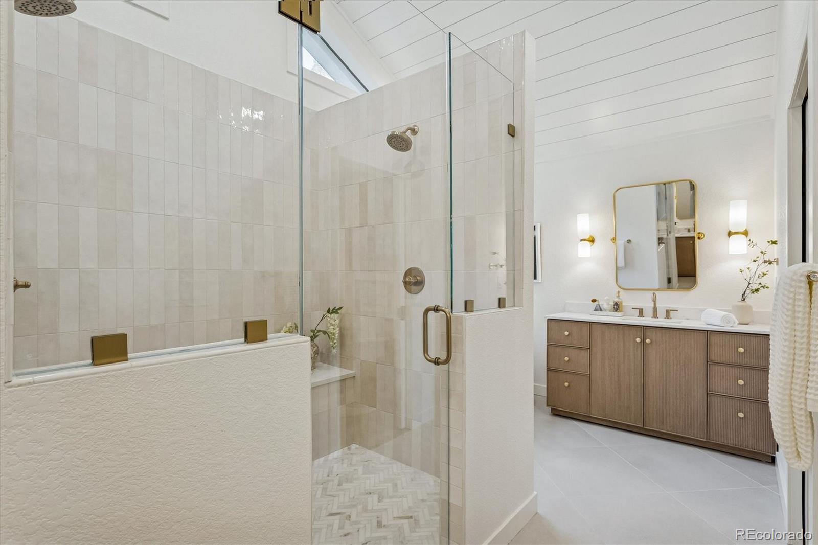 4872 Country Club Way Boulder, CO 80301 - Photo 23 of 48 a bathroom with a granite countertop sink a mirror and a shower