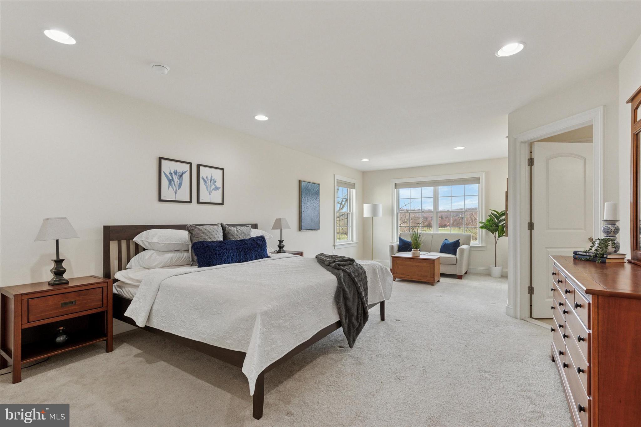 34 Parkview Cir. Wayne, PA 19087 - Photo 16 of 55 a bedroom with a bed couch and a large mirror