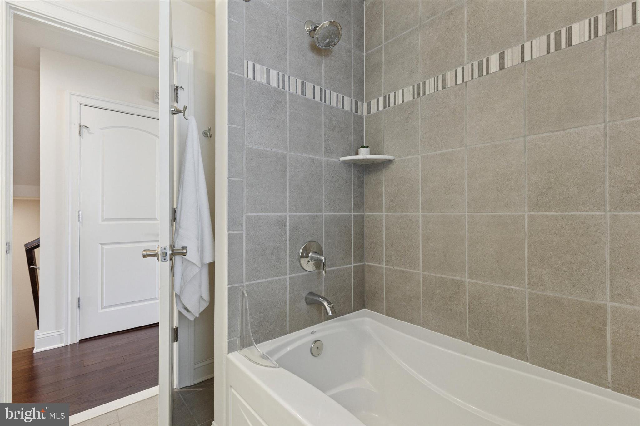 34 Parkview Cir. Wayne, PA 19087 - Photo 26 of 55 a white bath tub and shower