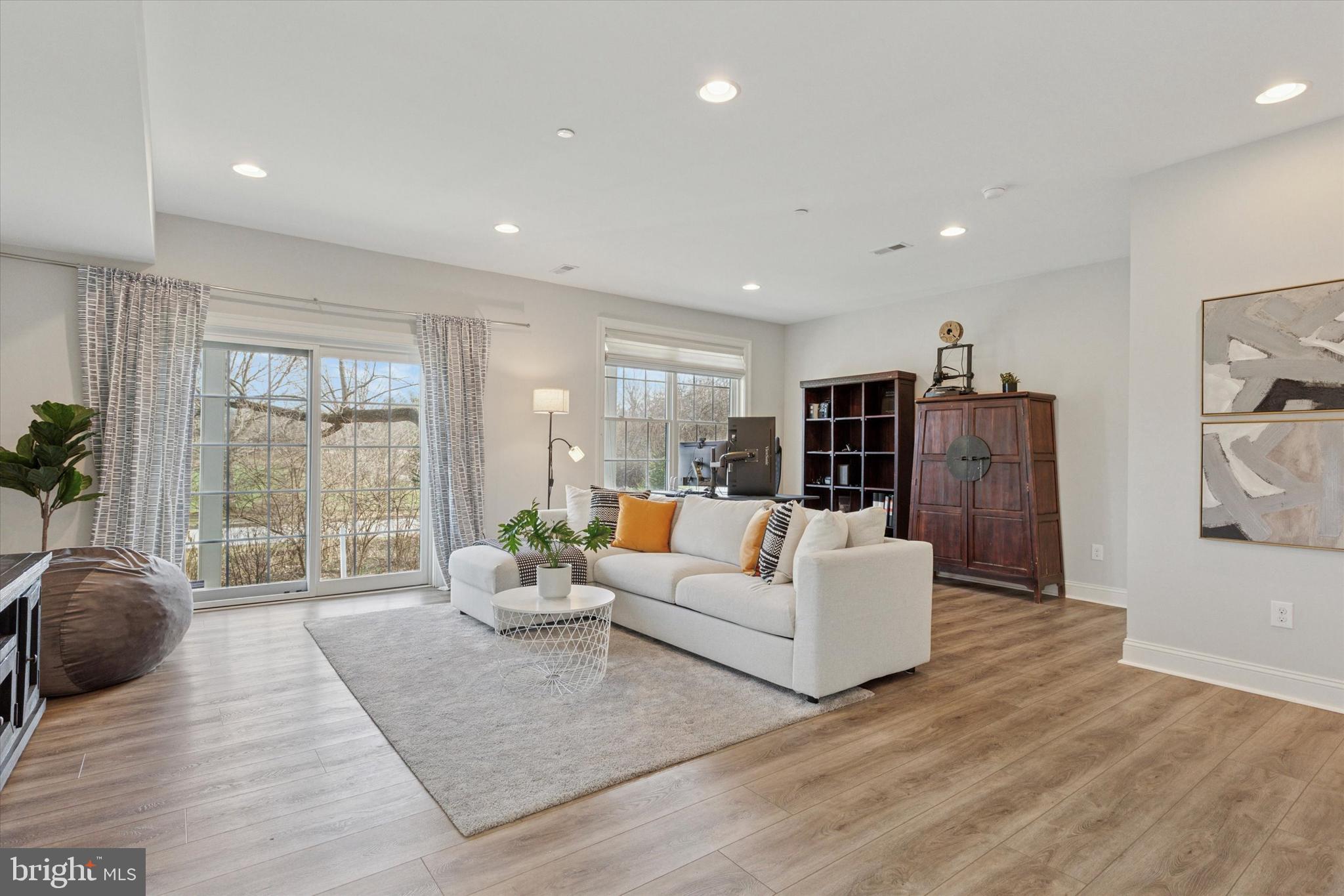 34 Parkview Cir. Wayne, PA 19087 - Photo 32 of 55 a living room with furniture large window and wooden floor