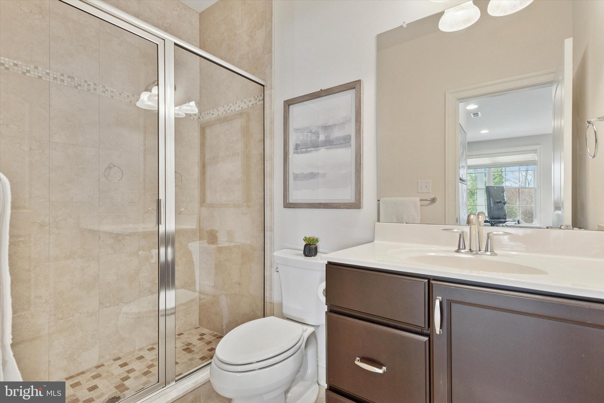 34 Parkview Cir. Wayne, PA 19087 - Photo 34 of 55 a bathroom with a sink toilet vanity and shower