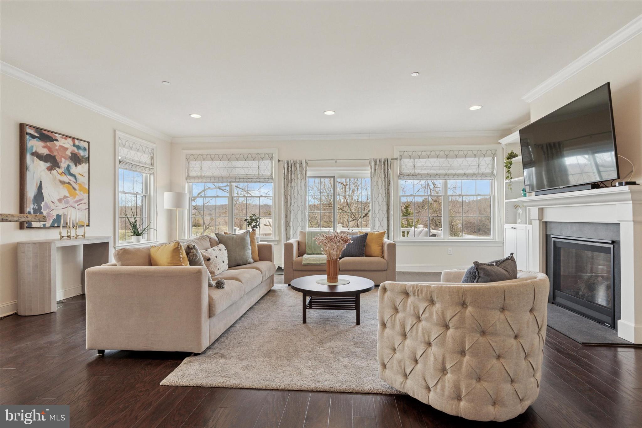 34 Parkview Cir. Wayne, PA 19087 - Photo 6 of 55 a living room with furniture fireplace and flat screen tv
