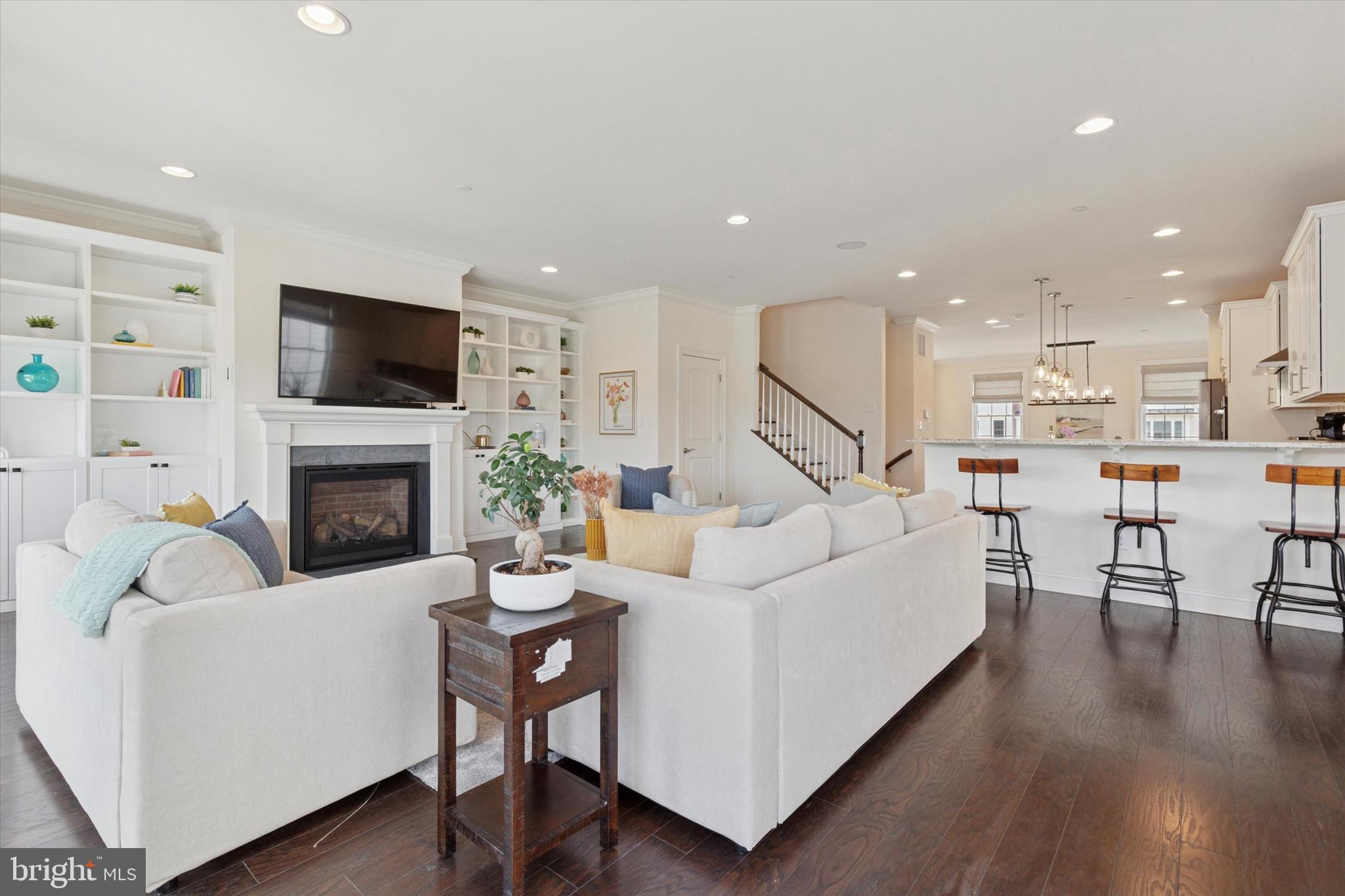 34 Parkview Cir. Wayne, PA 19087 - Photo 7 of 55 a living room with fireplace furniture and a flat screen tv