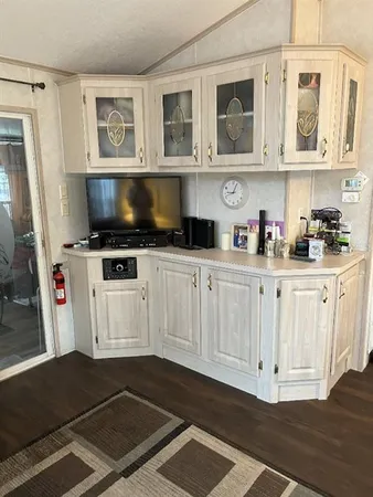 a kitchen with stainless steel appliances a stove a microwave and cabinets