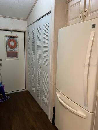 a view of a hallway with closet
