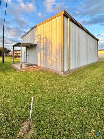 a view of a swimming pool with a chair