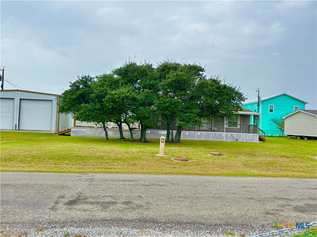 55 Scarlett Street Port O'Connor, TX 77982 - Photo 15 of 46 a view of a swimming pool with an outdoor space and seating area
