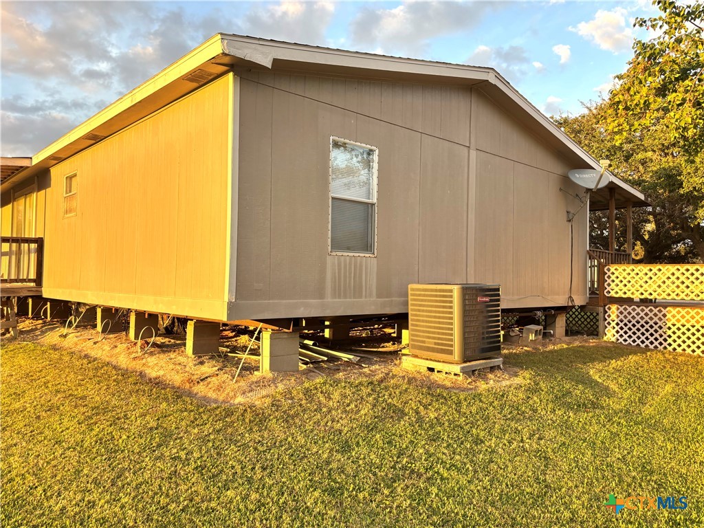 55 Scarlett Street Port O'Connor, TX 77982 - Photo 17 of 46 a front view of a house with a yard