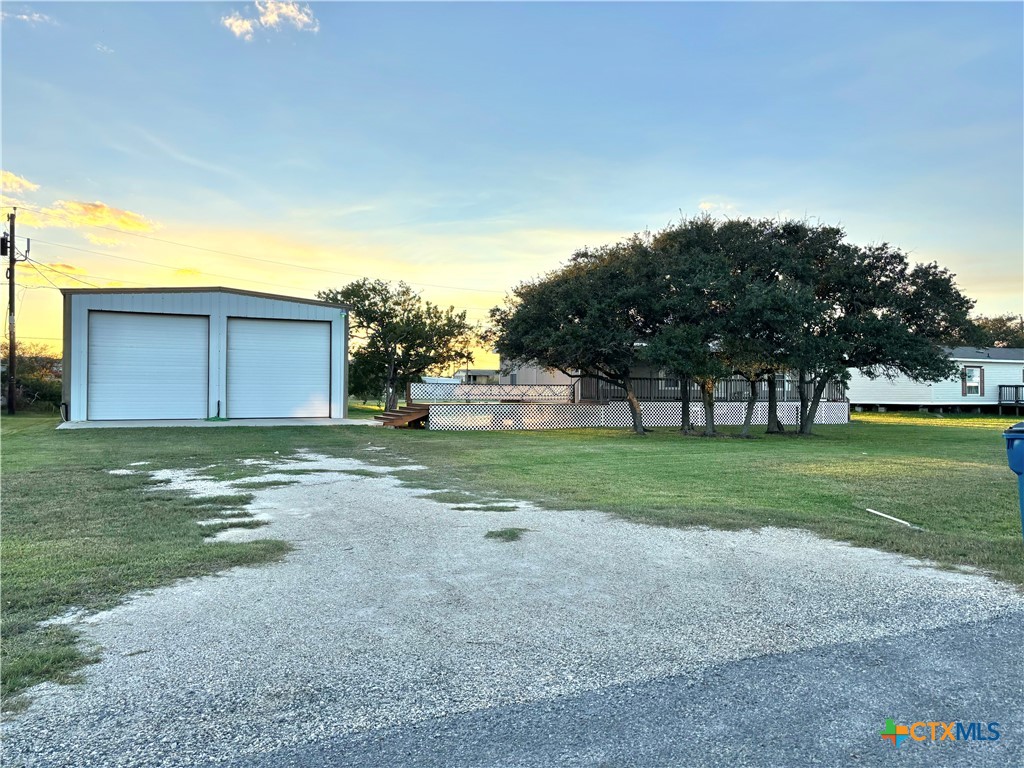 55 Scarlett Street Port O'Connor, TX 77982 - Photo 23 of 46 a view of a house with a yard