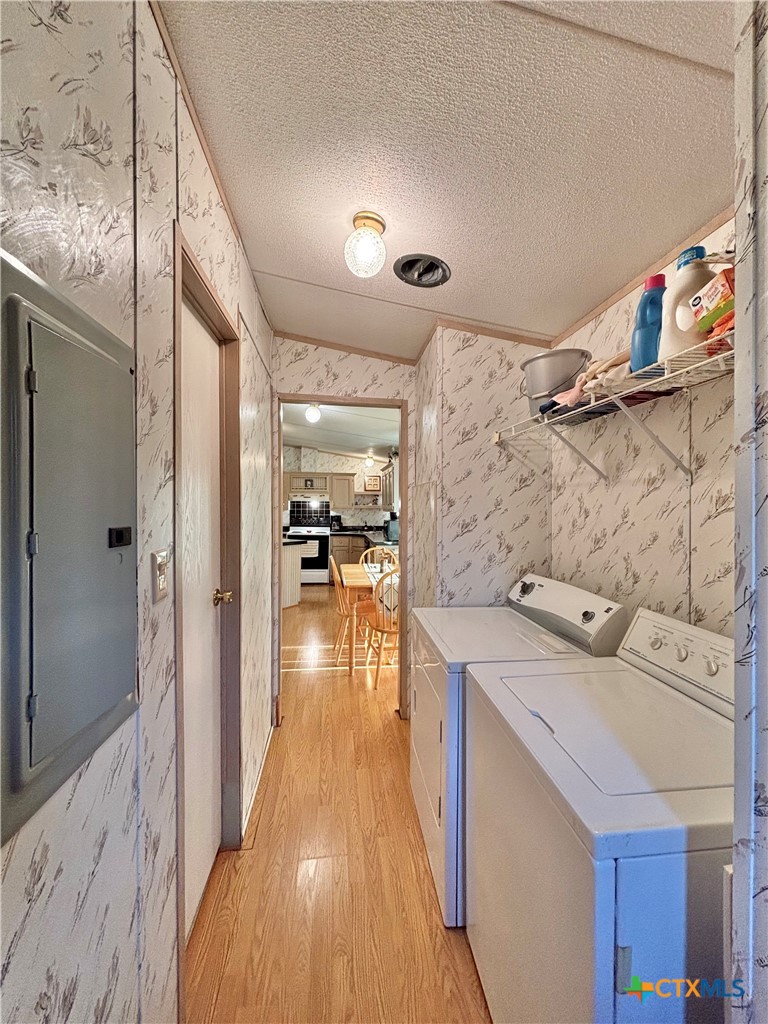 55 Scarlett Street Port O'Connor, TX 77982 - Photo 34 of 46 a hallway with a sink and wooden floor