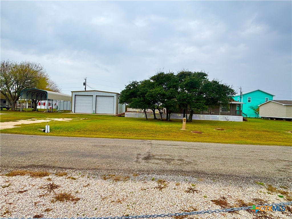 55 Scarlett Street Port O'Connor, TX 77982 - Photo 42 of 46 a view of a swimming pool with an outdoor space and seating area