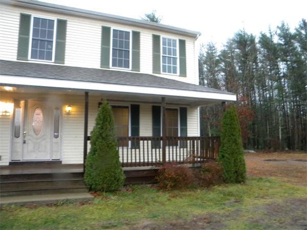 96 Sarah Sherman Road Rochester, MA 02770 - Photo 1 of 6 a view of a house with a small yard and a garden