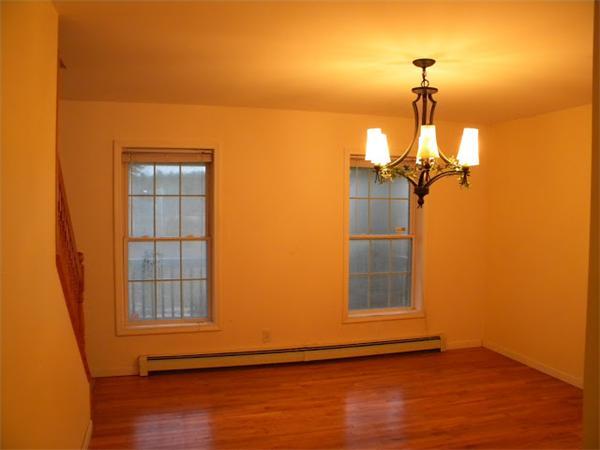96 Sarah Sherman Road Rochester, MA 02770 - Photo 4 of 6 a view of a room with wooden floor and windows
