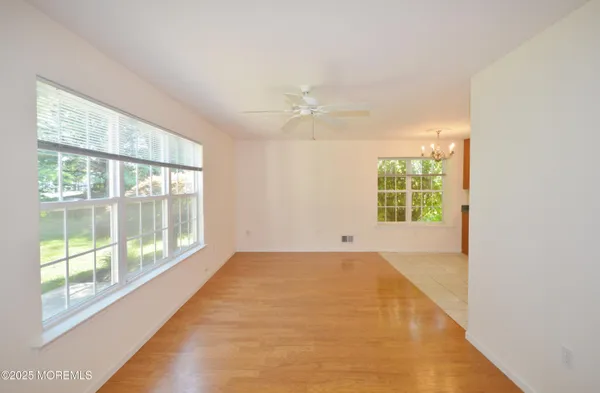 a view of a room with a floor to ceiling window and a yard