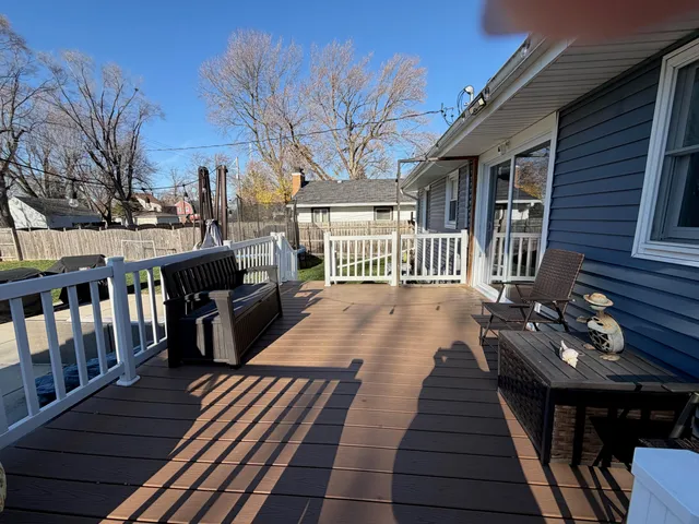 a view of a patio with a table and chairs