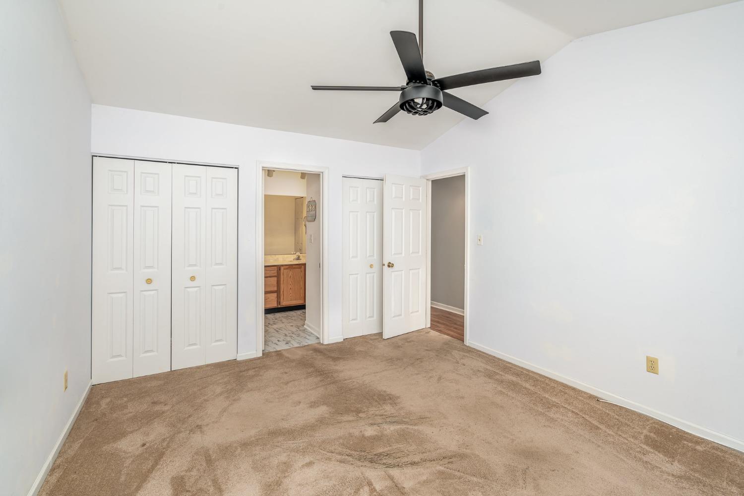 225 Clinton Street Lowell, IN 46356 - Photo 15 of 27 a view of a room with a ceiling fan and a bathroom