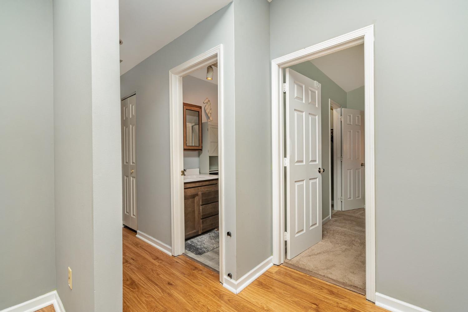 225 Clinton Street Lowell, IN 46356 - Photo 17 of 27 a view of a hallway with bathroom and sink