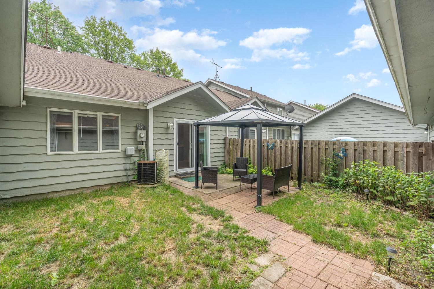 225 Clinton Street Lowell, IN 46356 - Photo 23 of 27 a backyard of a house with outdoor seating