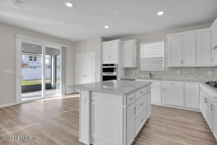674 Blind Oak Cir Street St. Augustine, FL 32095 - Photo 1 of 21 a kitchen with stainless steel appliances granite countertop a stove and a sink