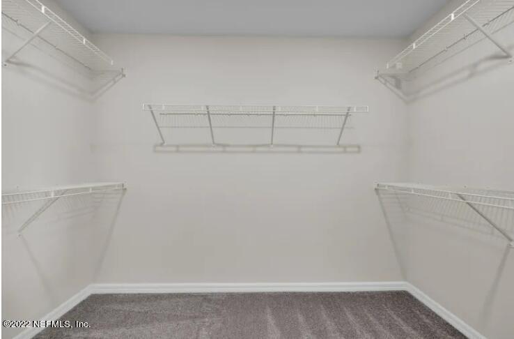 674 Blind Oak Cir Street St. Augustine, FL 32095 - Photo 10 of 21 a view of a room with racks on the wall