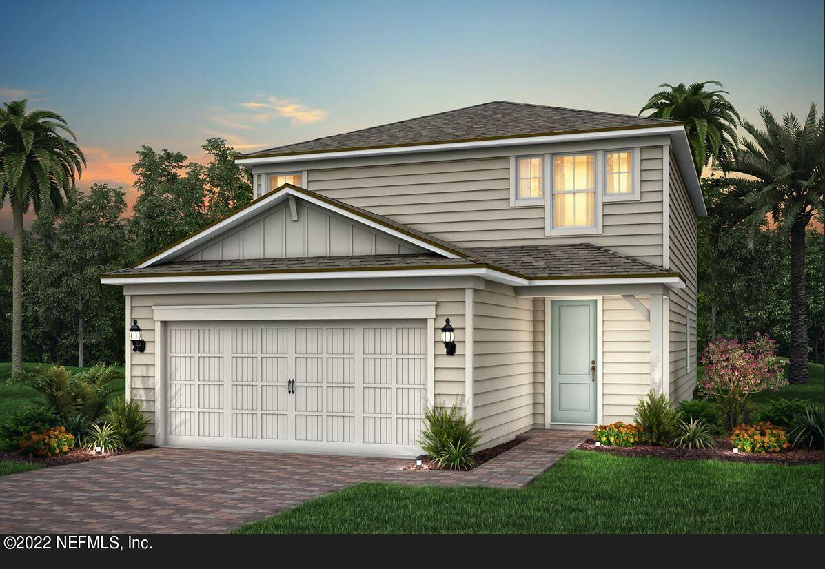 674 Blind Oak Cir Street St. Augustine, FL 32095 - Photo 3 of 21 a front view of a house with a yard and garage