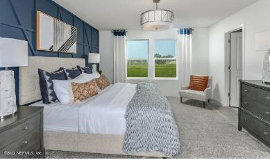 674 Blind Oak Cir Street St. Augustine, FL 32095 - Photo 7 of 21 a bedroom with a large bed and a window